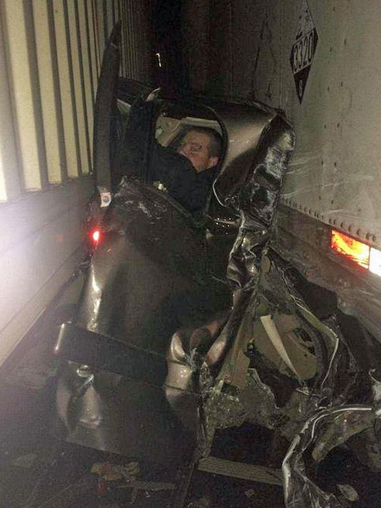 Incredible Photo Shows Man Pinned Between Semi Trucks In Pileup